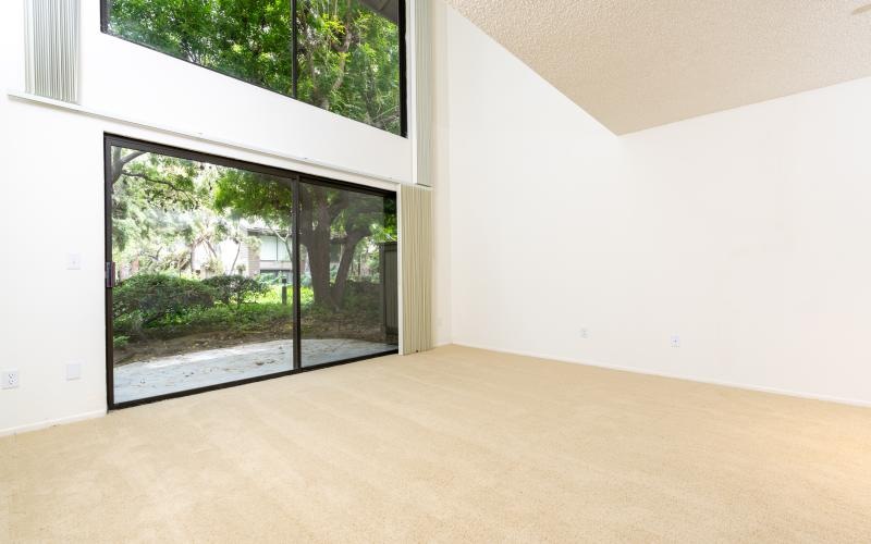 a room with a window and carpet