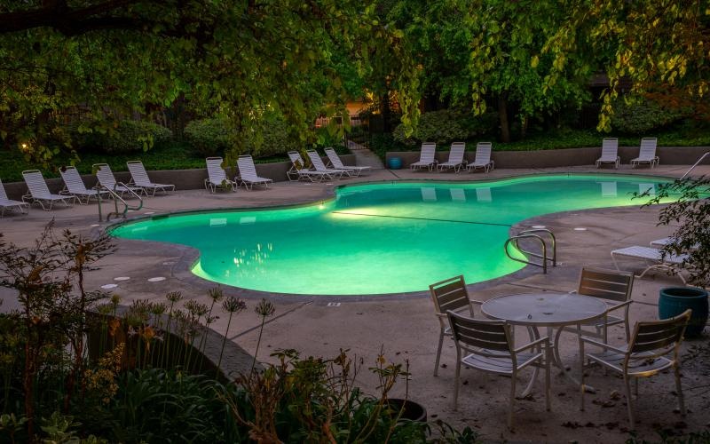 a pool with chairs around it