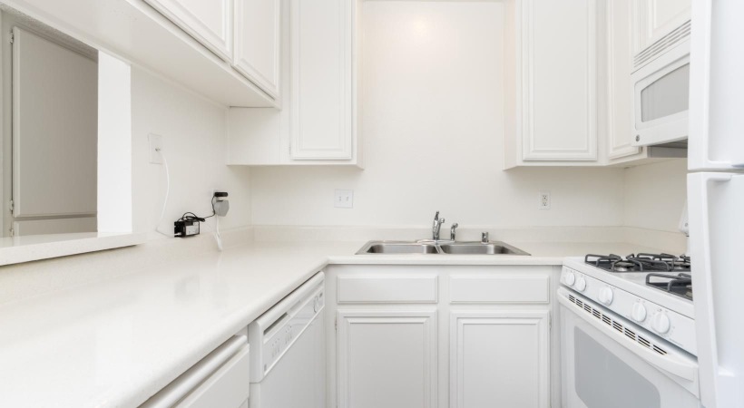 Spacious kitchens with thoughtful details a kitchen with white cabinets