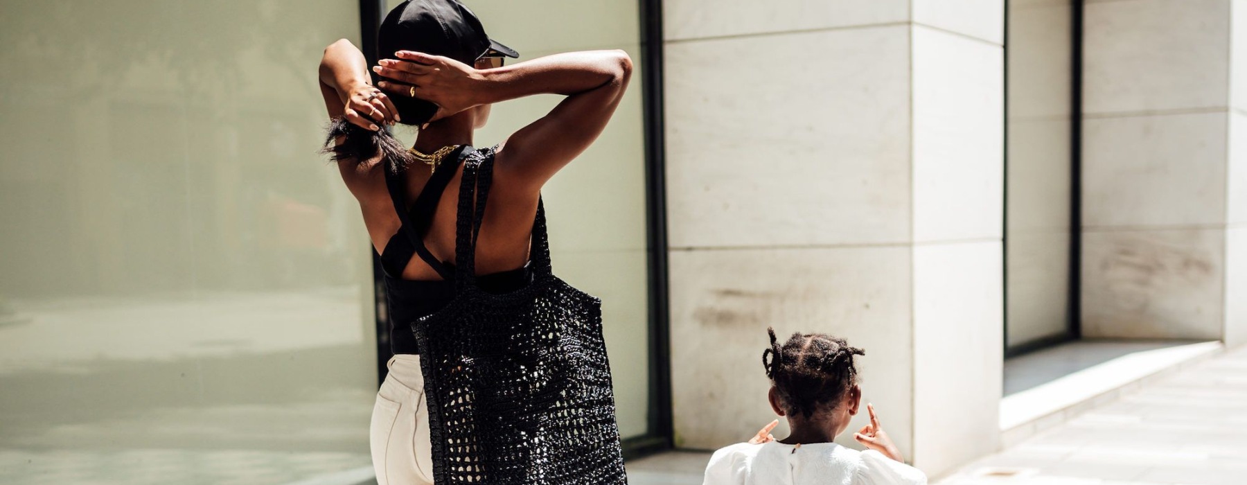 a woman walking with her child